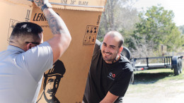 Infinity AC of Austin tech getting a system down from truck Infinity AC of Austin tech getting a system down from truck